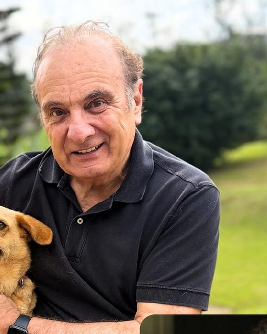 Retrato de Ricardo Tripoli com um cão